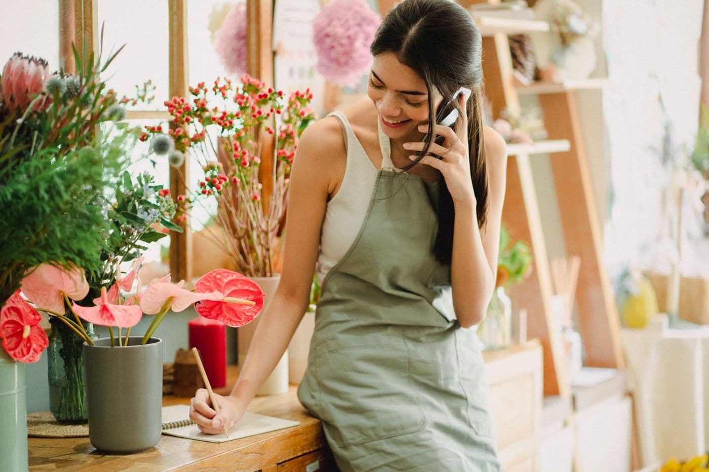 A florist taking an order on the phone